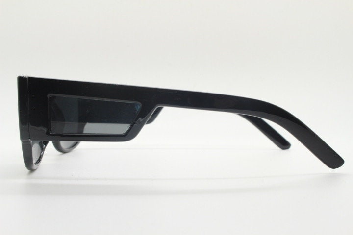 Y2K vintage rectangular side panel sunglasses. Black gloss frame with grey lenses and side window spoilers / blinkers. 2000s NOS goggle