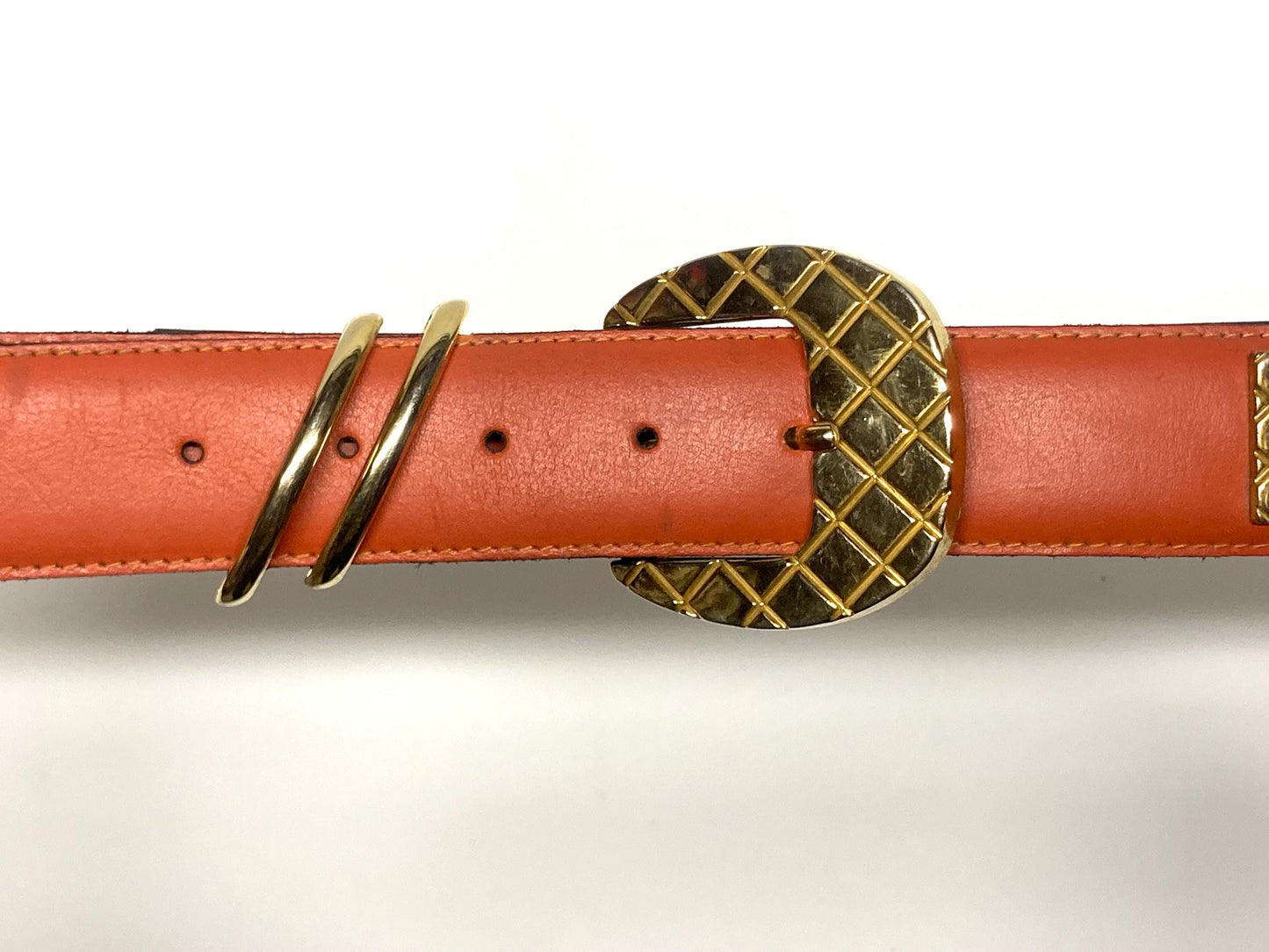 80s vintage womens dress / jeans belt in bright orange leather with golden metal squares. Made in France. Used in good condition