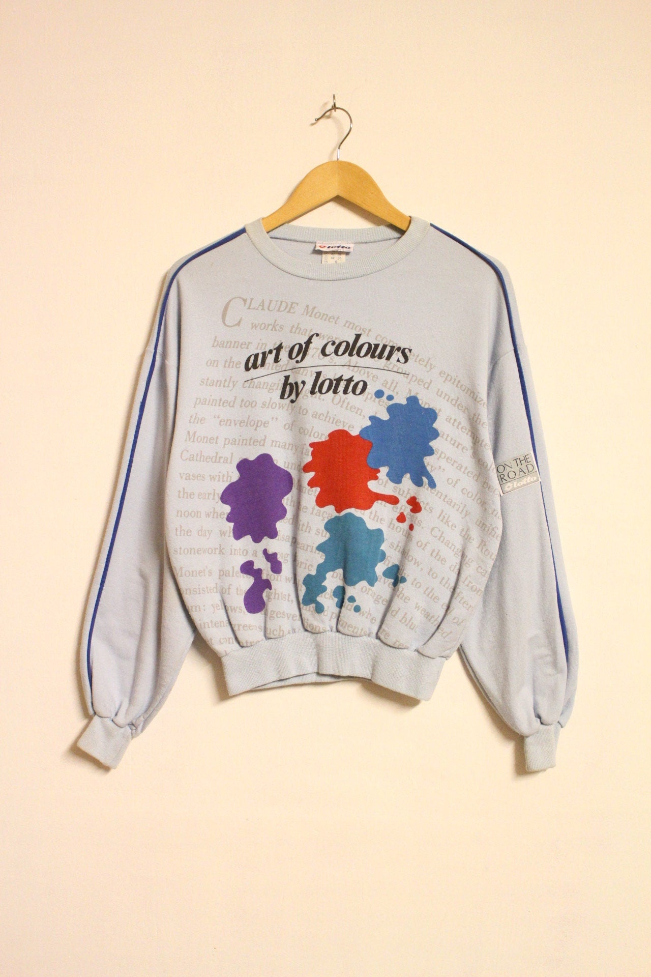 Vintage 80s blue sweatshirt by Lotto with 'art of colours' paint splash graphic. Made in Italy.