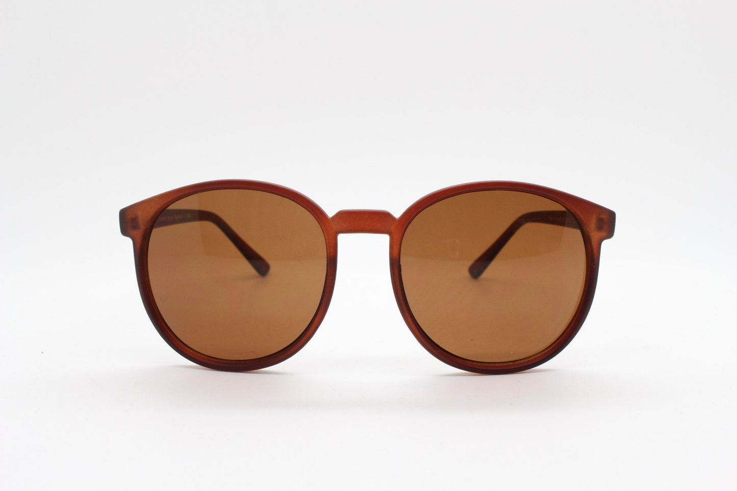 80s vintage round sunglasses. Slightly oversized slim transparent brown frame in a rubber finish with matching lenses. BNWT