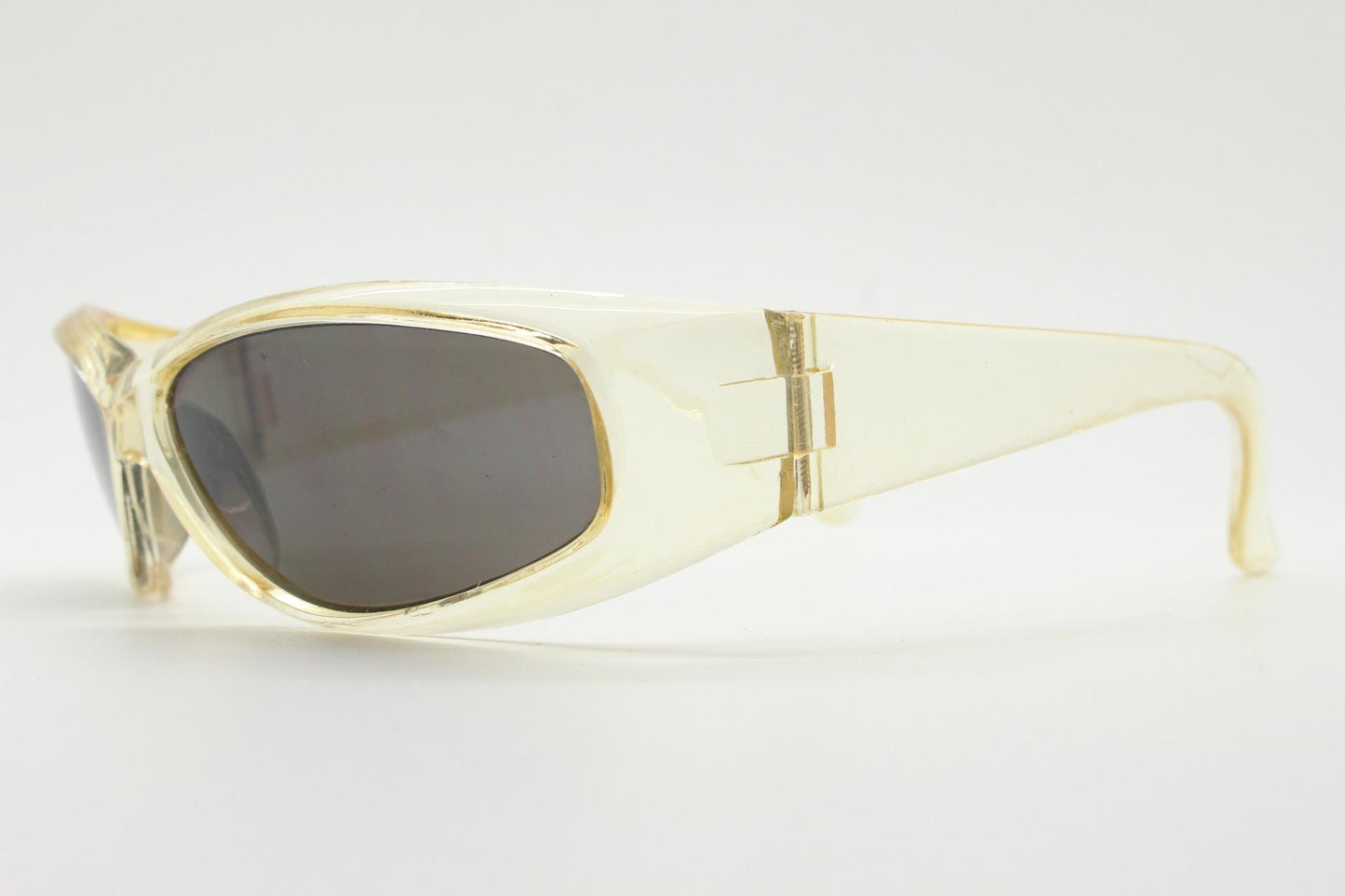 90s vintage sports shield sunglasses. Transparent yellow aerodynamic curved wraparound frame with contrasting black lenses. 2000's rave