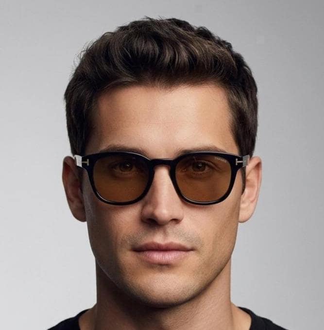 Tom Ford vintage wayfarer design sunglasses made in Italy. Slightly cat eye form in plain black gloss acetate with gold arms
