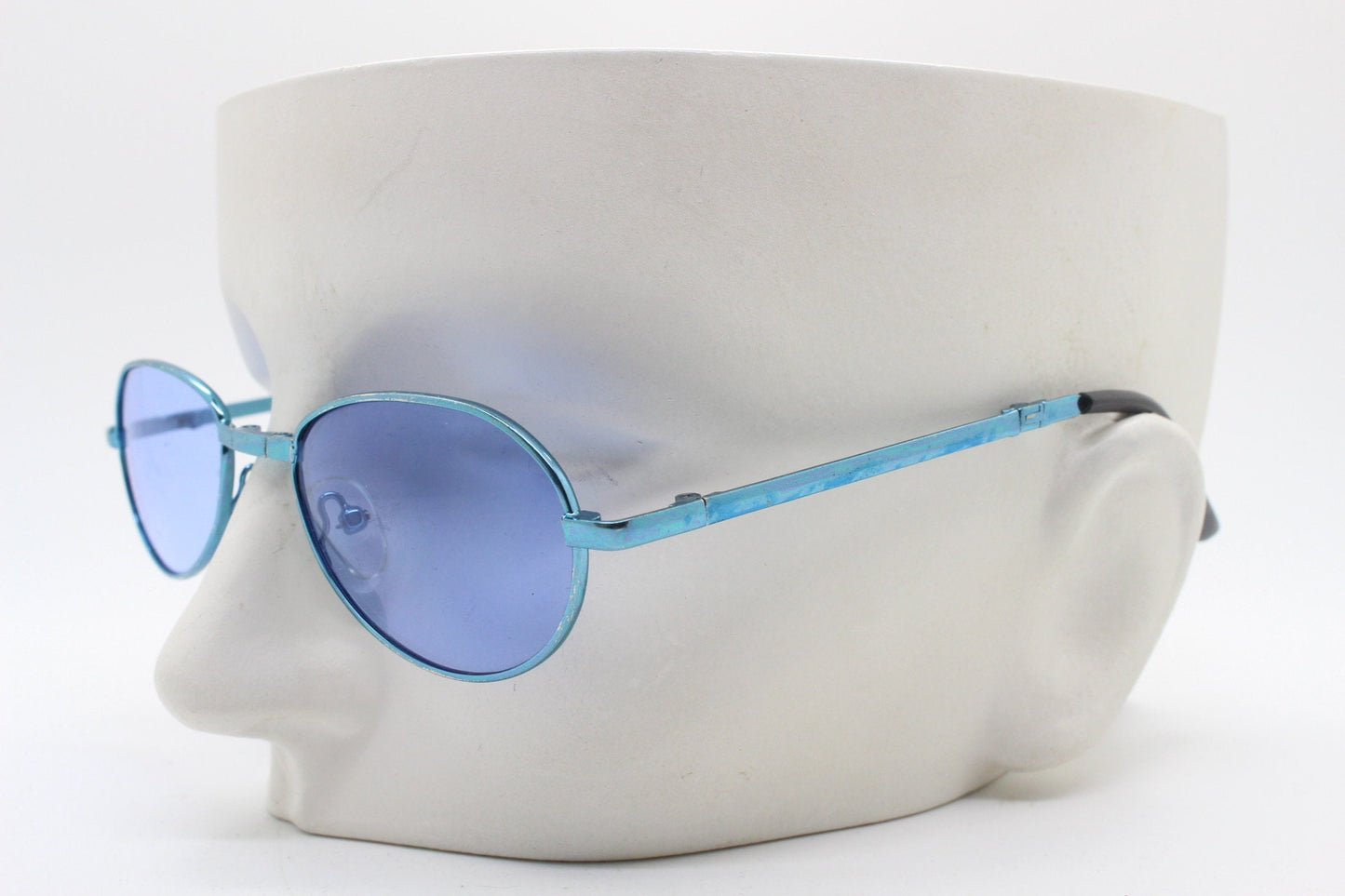 Y2K micro foldable oval sunglasses. Sky lenses in a small folding matching coloured compact frame. Folder. Rave 2000s. 90s NOS