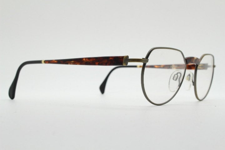 Silhouette vintage 90s flat top oval eye glasses made in Austria. Satin bronze optical frame with honey tortoise trim. Prescription RX