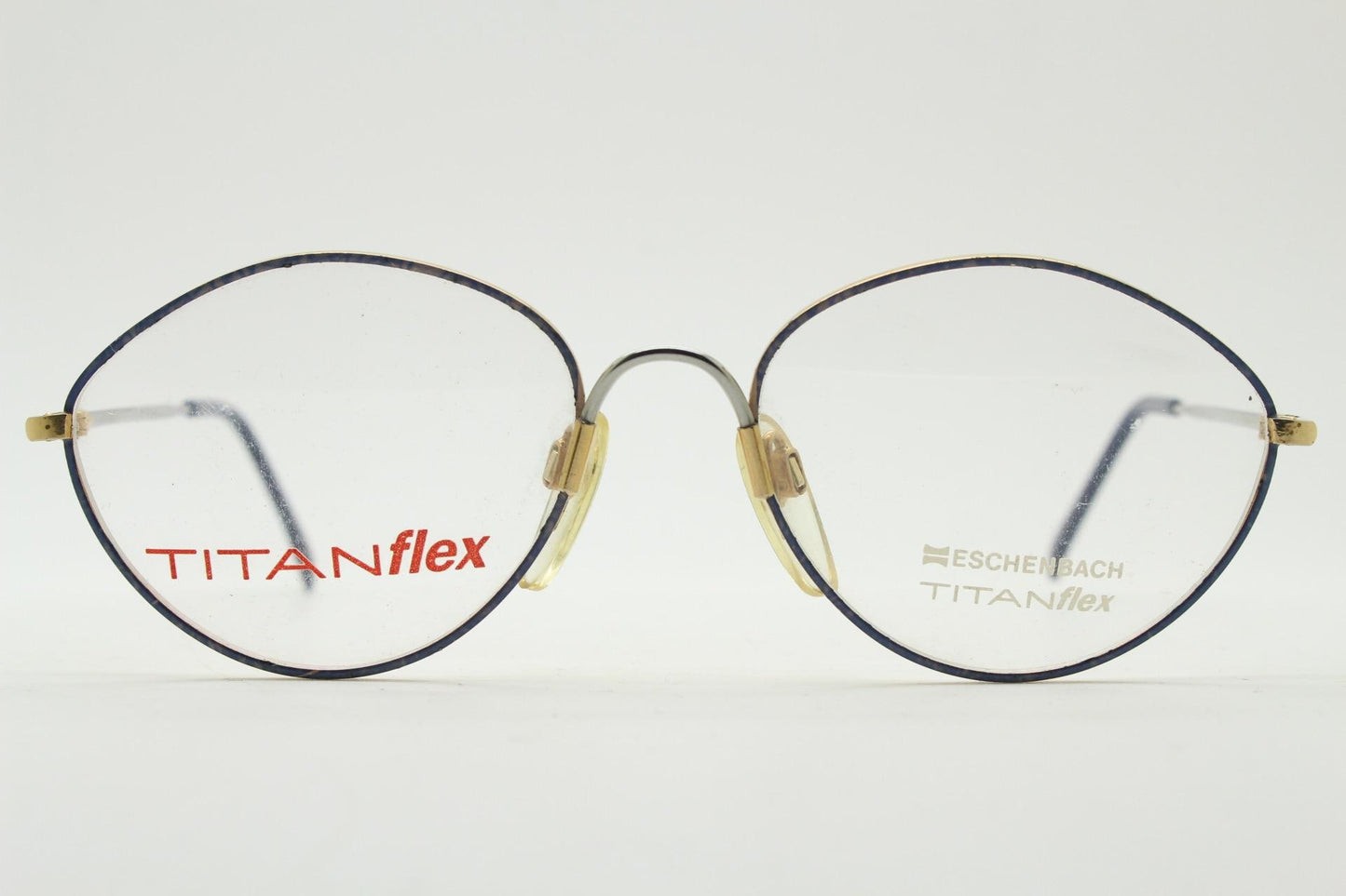 Eschenbach 90s vintage oval eye glasses made in Germany. Titanium optical frame with tasteful purple marbled front. Prescription NOS