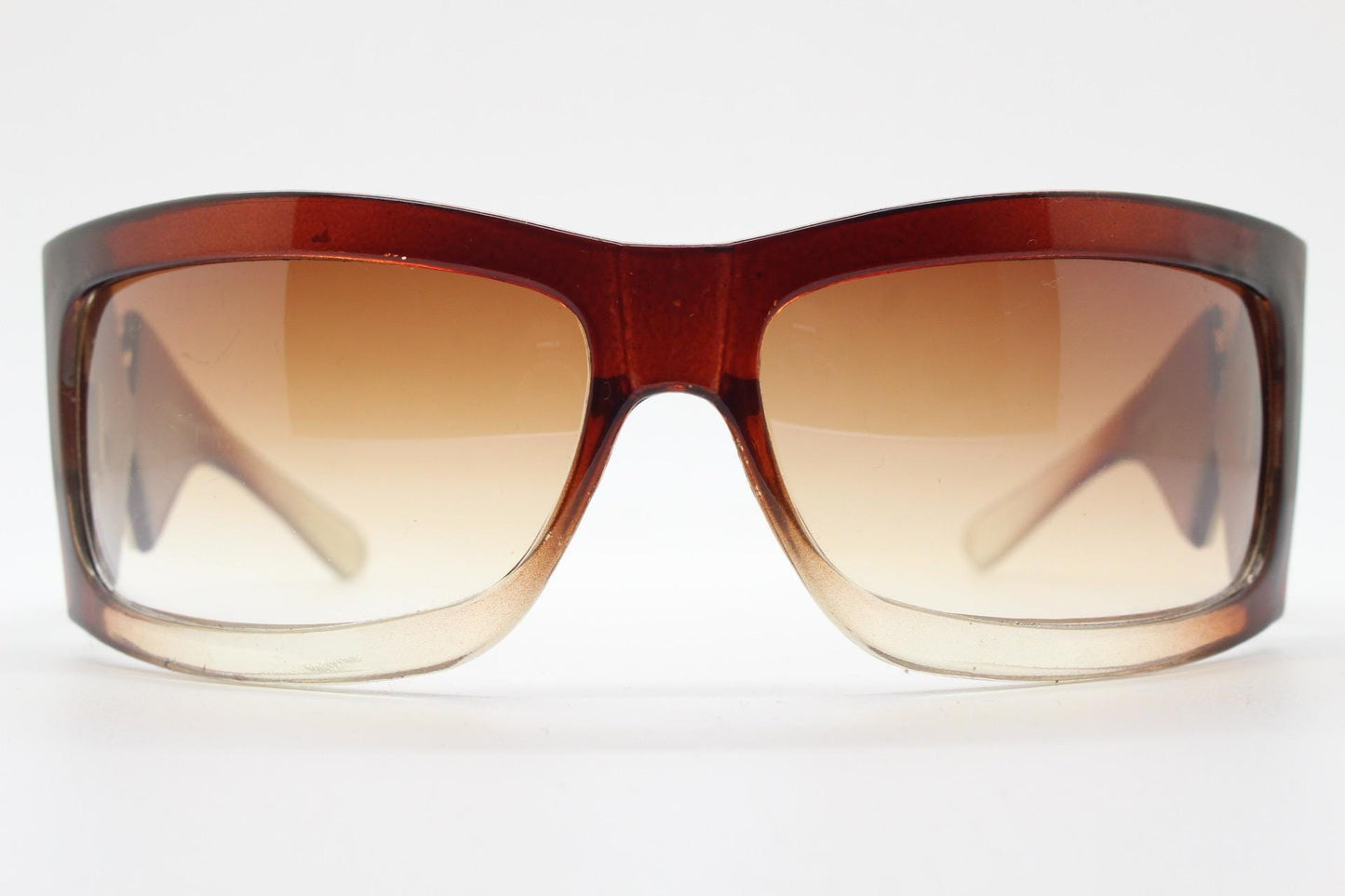 Y2K vintage big wrap around sunglasses. Transparent brown shield design with hot graduating lenses and big X crest. 2000s bug eye. NOS