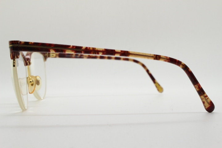 Versace 90s vintage brow line cat eye glasses made in Italy. Elegant tortoise acetate cateye optical half frames. Prescription RX eyeglasses