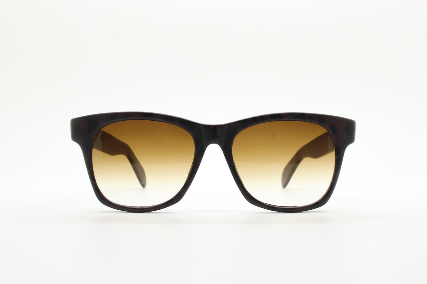 Vintage 80s square horn rim sunglasses. All time classic design in chunky matt black and brown frame with superb graduating lenses. NOS