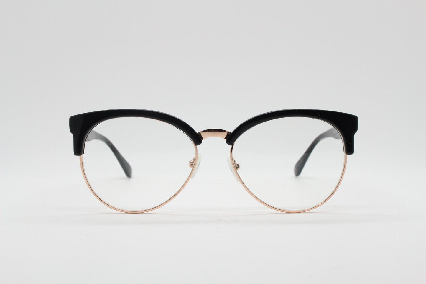90s vintage modified cat eye glasses. Black gloss browline half frame eyeglasses with gold underwire. 50s, 60s design cateye. NOS