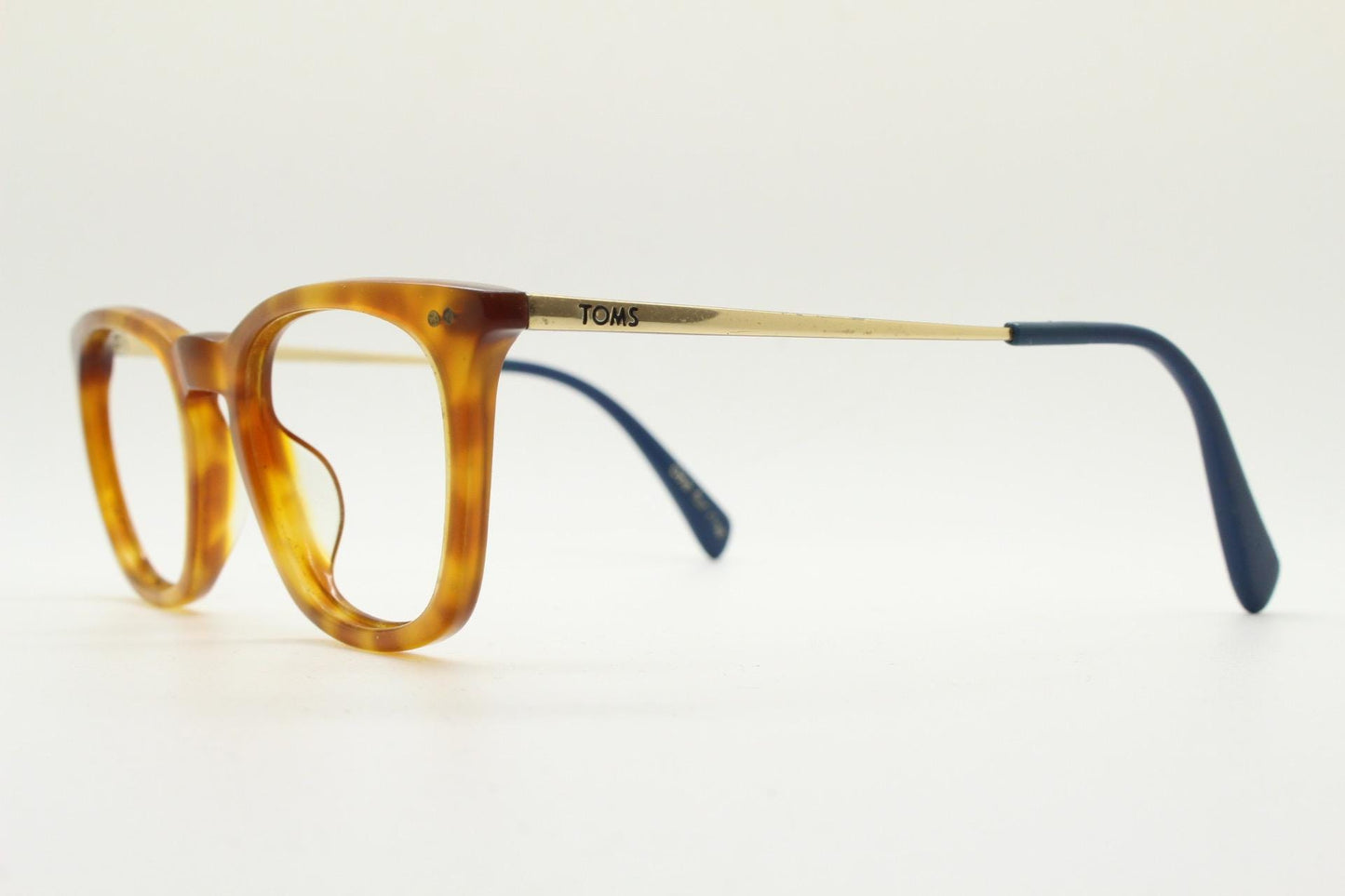 Tom's rectangular horn rim eye glasses. Classical 40s design in amber acetate with gold arms. Prescription optical frames. RX spectacles