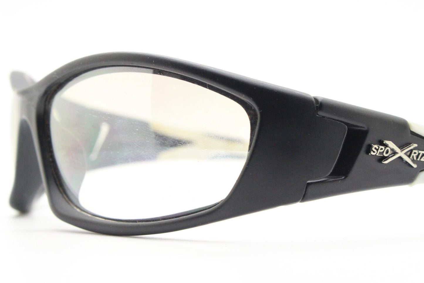 90s vintage sports sunglasses. Black matt aerodynamic wraparound with straight white rubber arms and light tone lenses. Y2K rave shield