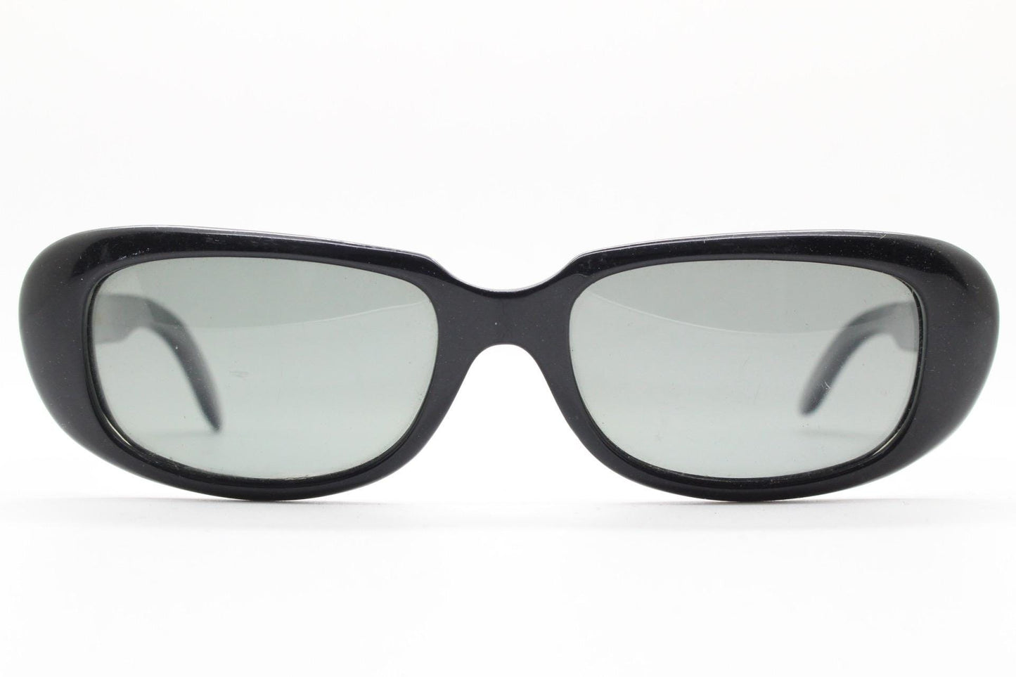Polaroid 60s vintage rectangular sunglasses made in England. Authentic plain black frame with atmospheric curved lenses. Mens mod