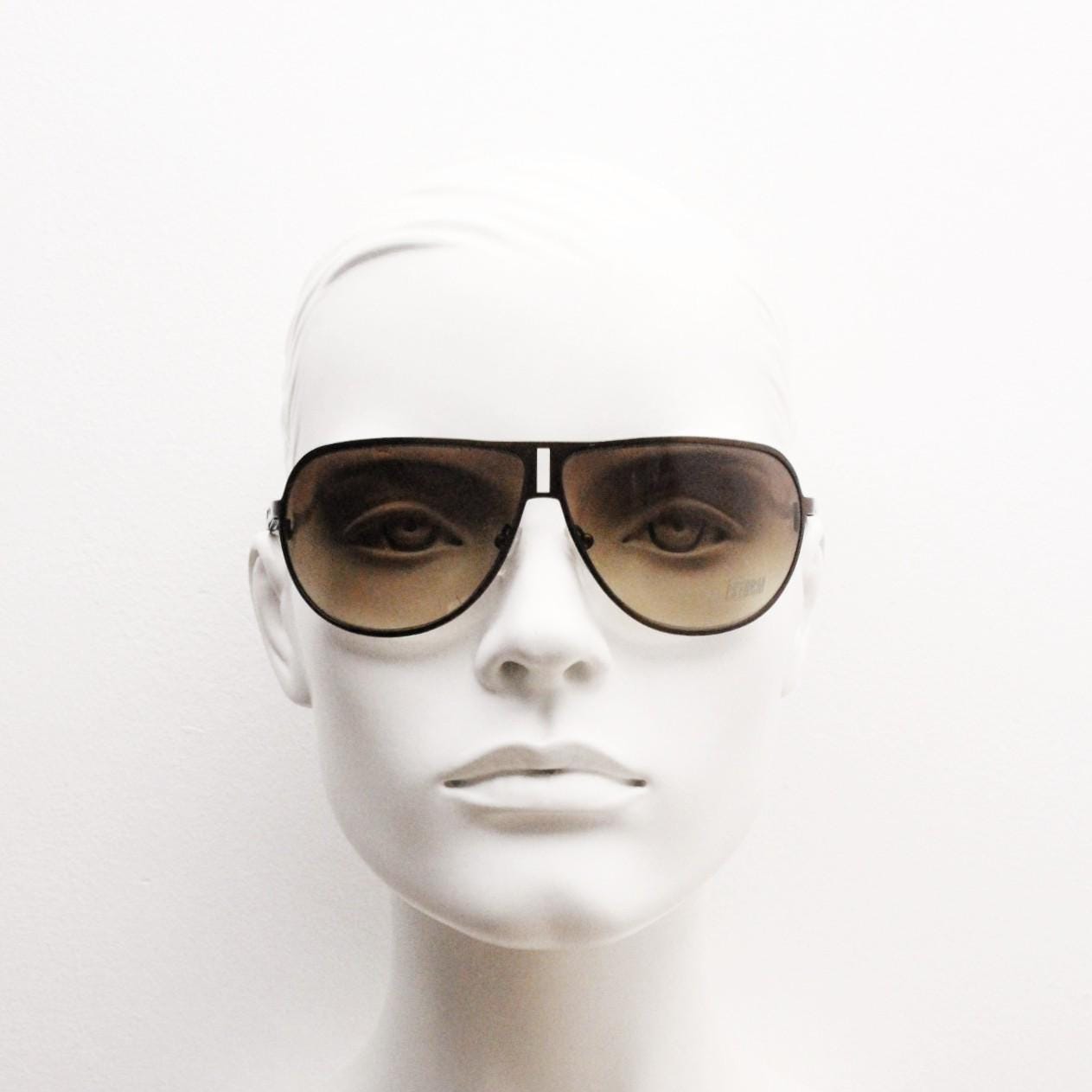 Storm Y2K bug eye aviator sunglasses model Photon. Bronze satin finish shield style aviators with graduating brown lenses.  Unused NOS.