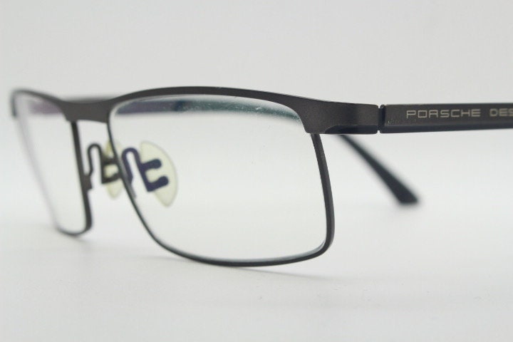 Porsche design rectangular eye glasses model 8251 made in Japan. Minimal gunmetal grey wire optical frame. Prescription RX spectacles