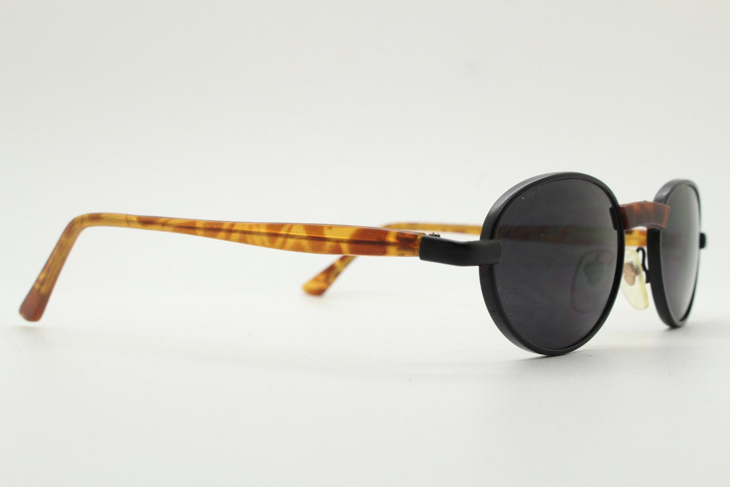 90s oval vintage metal sunglasses. Classic 1990s features of minimal satin finish solid frame with matt tortoise arms. Steampunk. Unused NOS
