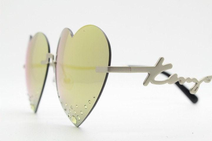 Kenzo mirror heart shaped frameless sunglasses model KZ40005U. Instant classic design with diamantes and big spell out arm logo. NOS