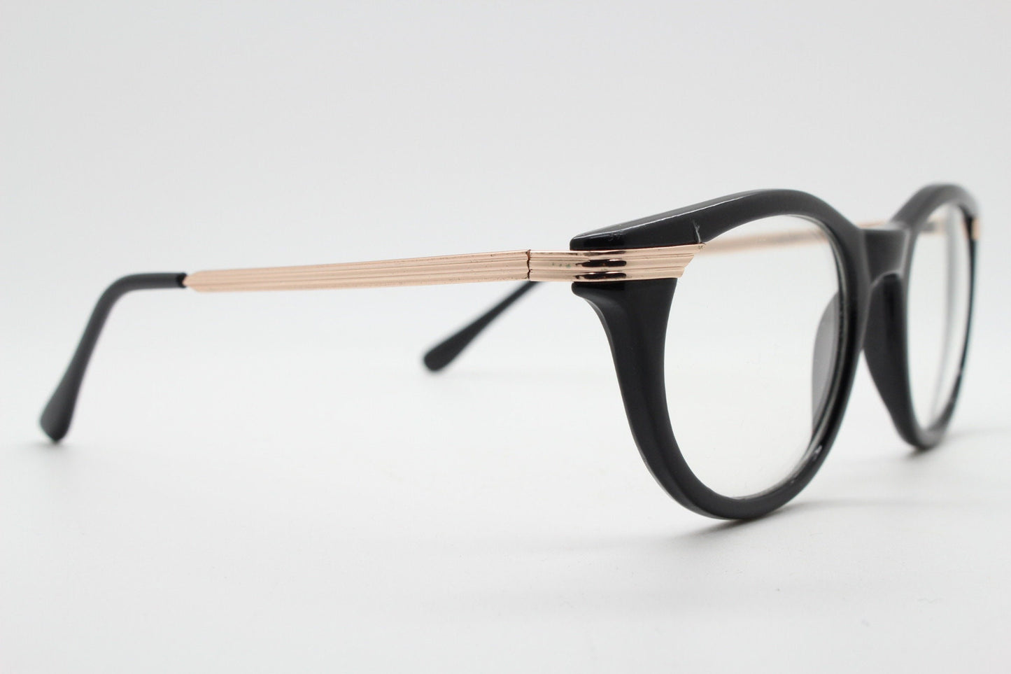 90s vintage cat eye glasses in black with gold metal arms. 50s, 60s style cateye prescription optical frames. Clear lens eyeglasses. RX