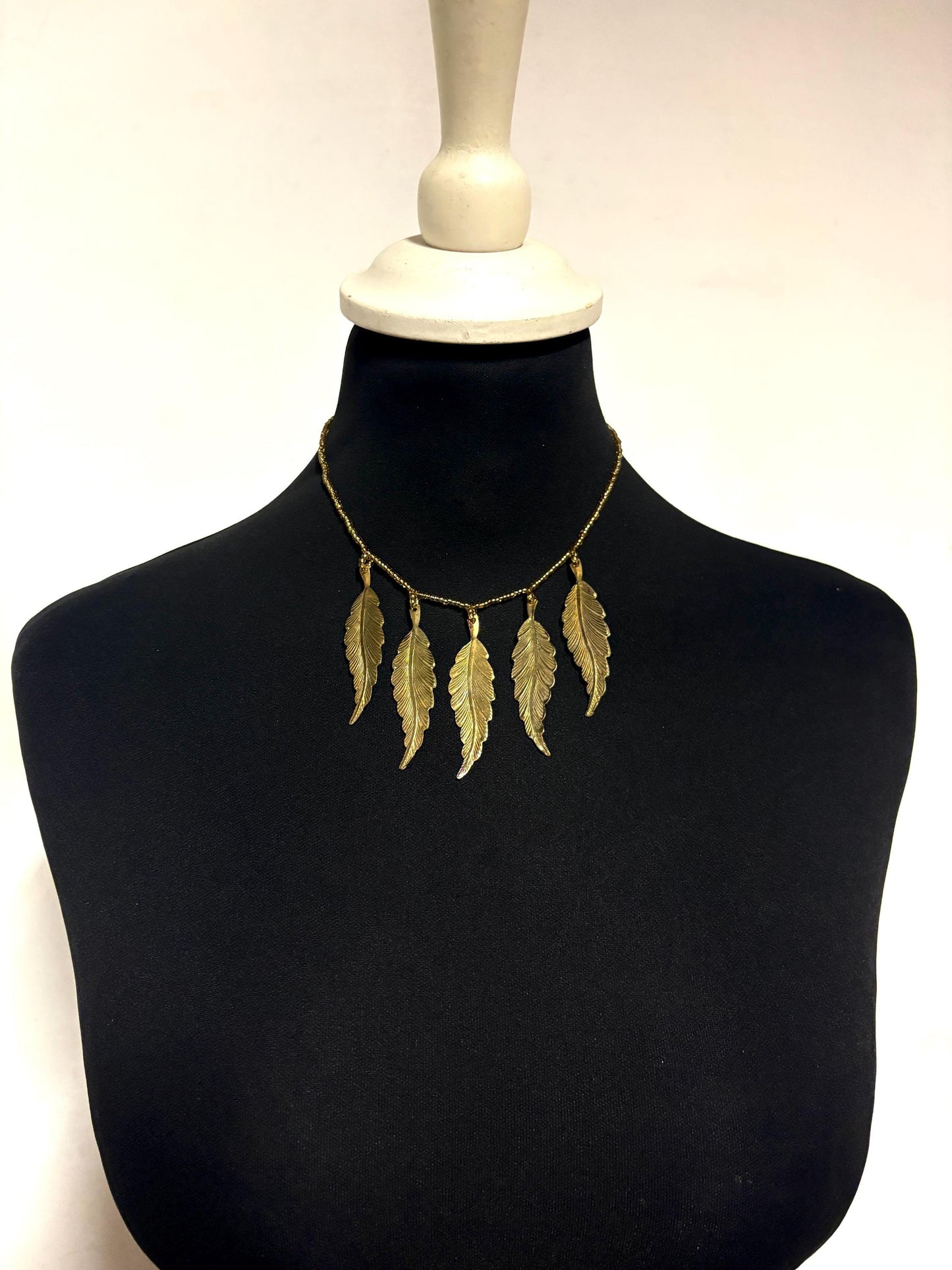 80s vintage gold beaded necklace with large dangling leaves . Charming statement piece. Country and western. Native american