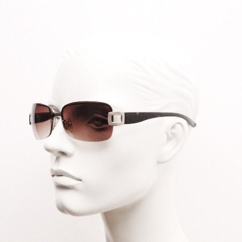 Y2K vintage rectangular brown sunglasses. Gold half frame 2000's wrap around with curved lenses, gold trim and temple crests. Unused NOS