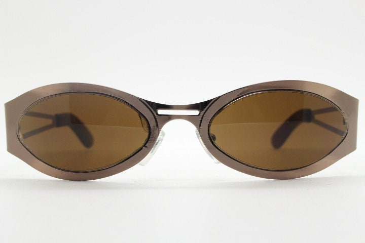 2000s vintage wraparound angular sunglasses. Brown chrome flat curved metal frame with cut out arms. 90s. Y2K unused NOS