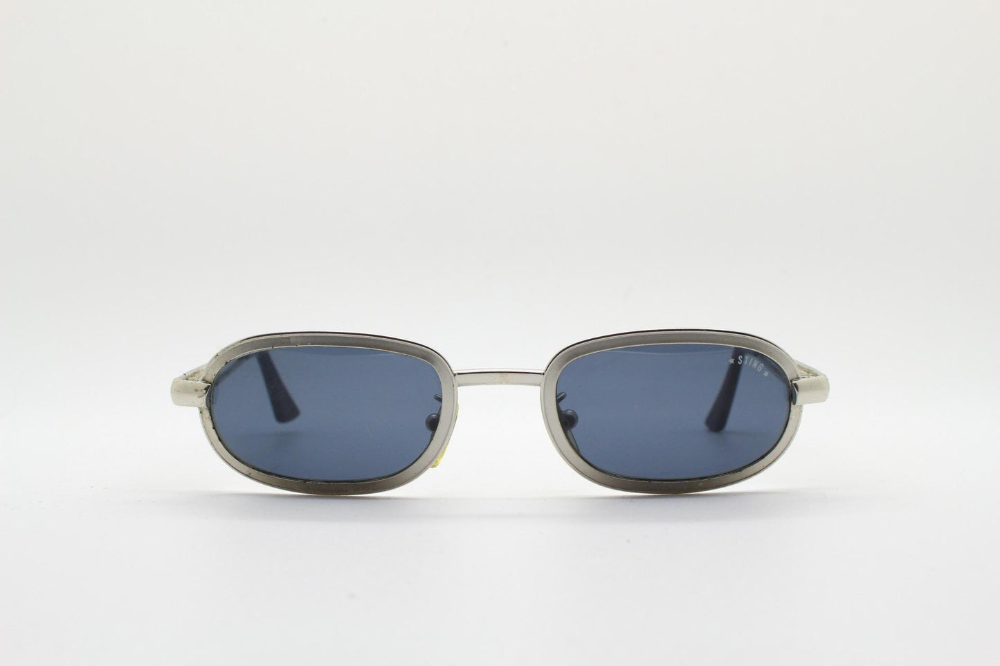 Sting 90s vintage oval sunglasses. Minimal 'Industrial tech' style in slightly small proportions that's quirky but in a quality finish