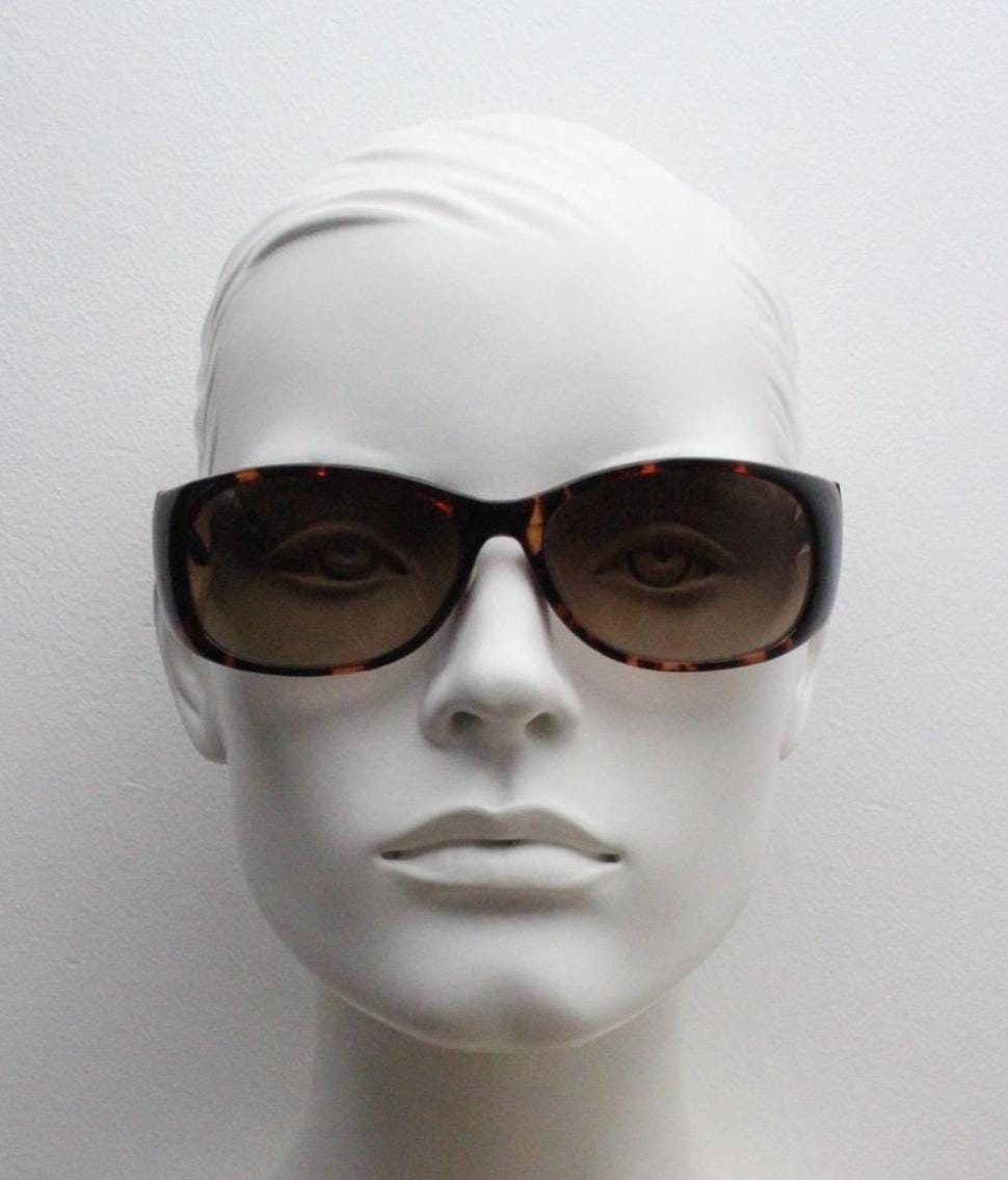 Y2k vintage wrap around bug eye sunglasses. Aerodynamic 60s design tortoise frame with full height arms in excellent proportions. 2000's NOS