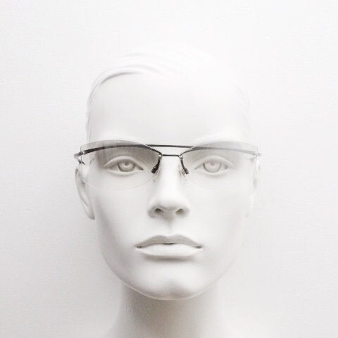 Y2K vintage wraparound sunglasses. Sick fashion grail half frame in grey chrome with extra light tone curving mirrored lenses. 2000's NOS