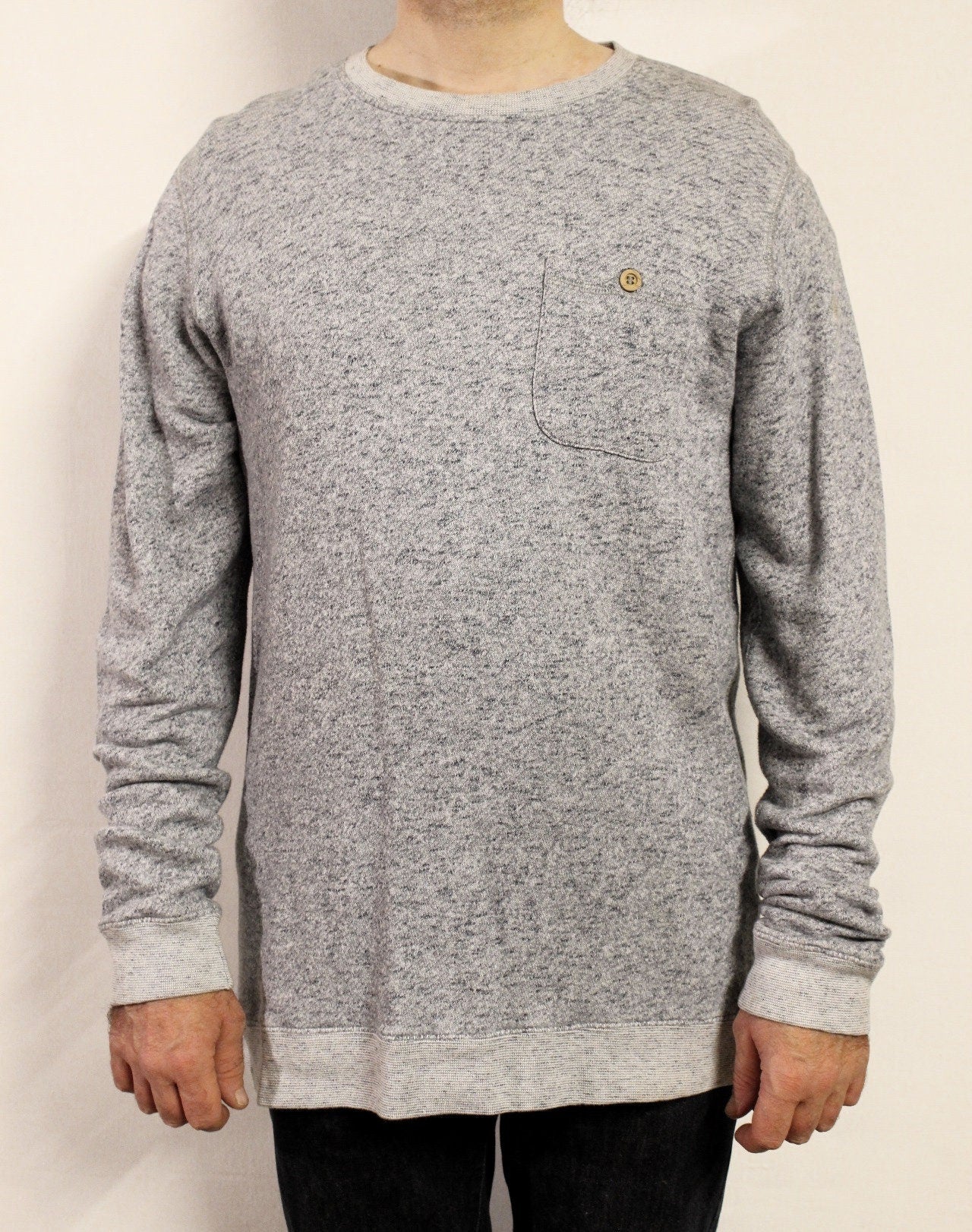Shore Leave grey fleck long sweatshirt. Crew neck pullover with outside chest pocket. Pure cotton round neck mens jumper