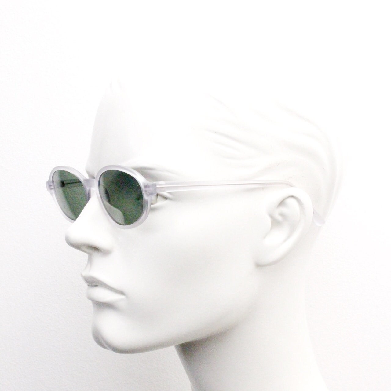 Vintage 90s futuristic oval sunglasses. Frosted transparent frame cat eye with dark green lenses. Unused NOS