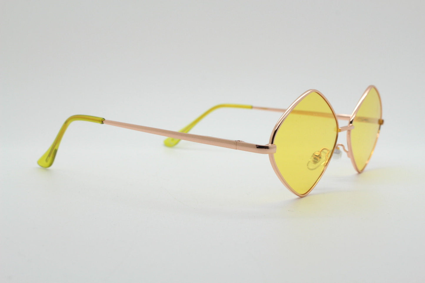 90s vintage diamond sunglasses. Minimal rose gold frame with psychedelic mod style yellow lenses. Unused BNWT