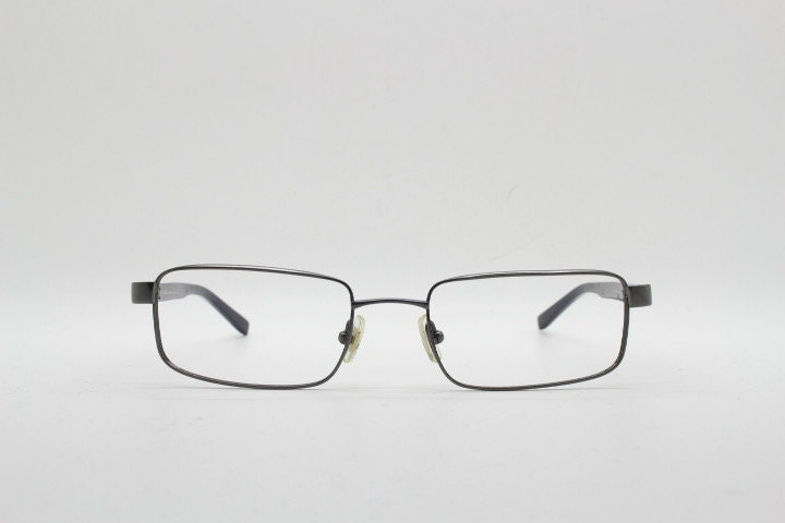 Calvin Klein collection rectangular eye glasses model 582 made in Japan. Gunmetal grey wire optical frames. Prescription eyeglasses. RX