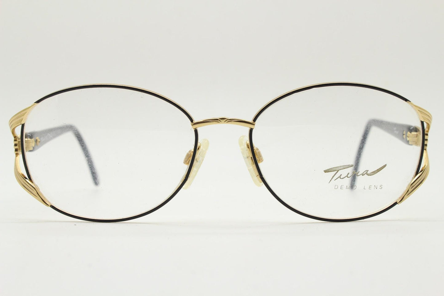 Tura 80s vintage oval eye glasses made in Italy. Womens black and gold optical frame with Y forked temples. Prescription RX. Unused NOS