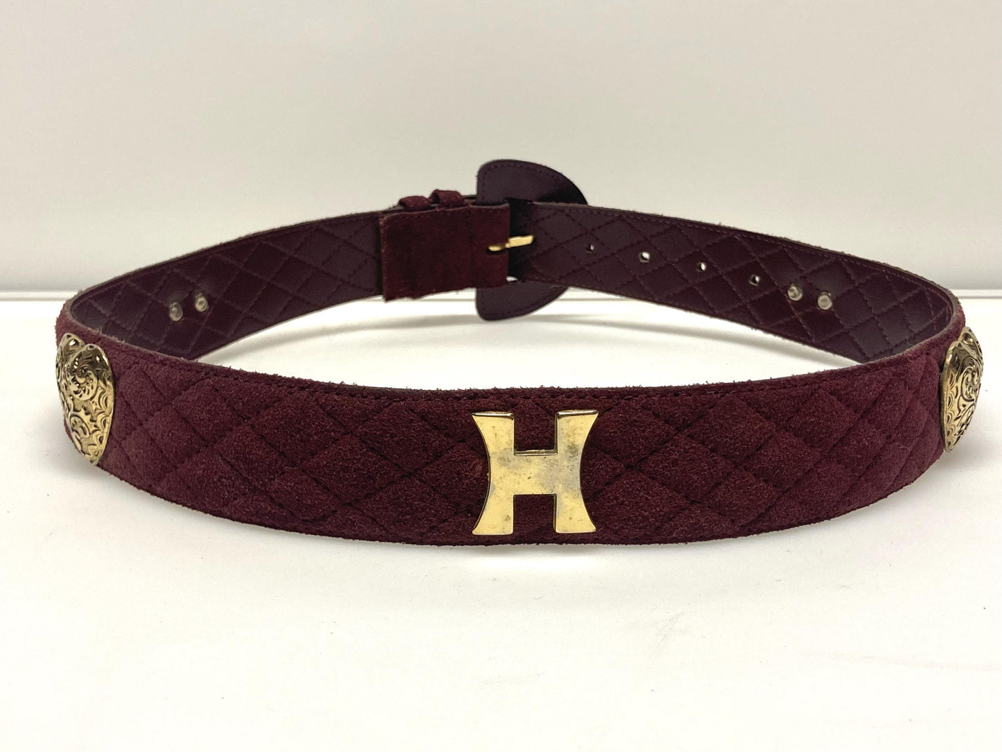 80s vintage womens dress belt in wine real suede with substantial covered buckle and gold domed hearts. Made in France by Chanon. NOS