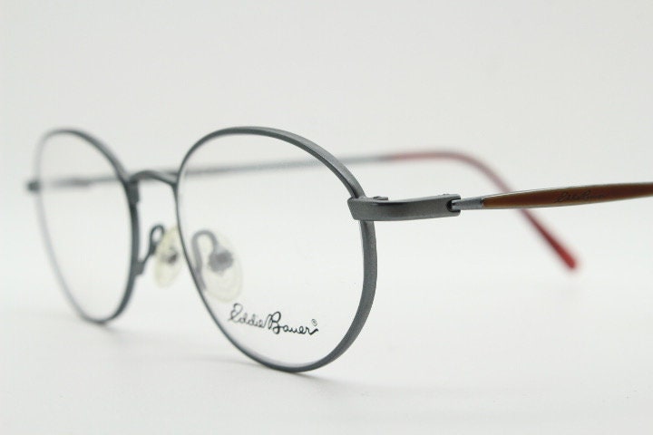 Eddie Bauer 90s vintage oval eye glasses.Grey matt finish optical frames with subtle brown trim. Prescription RX spectacles. NOS
