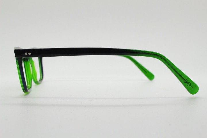 Green rectangular low profile wayfarer design eye glasses by found of Switzerland. Green gloss acetate optical frames. Prescription RX