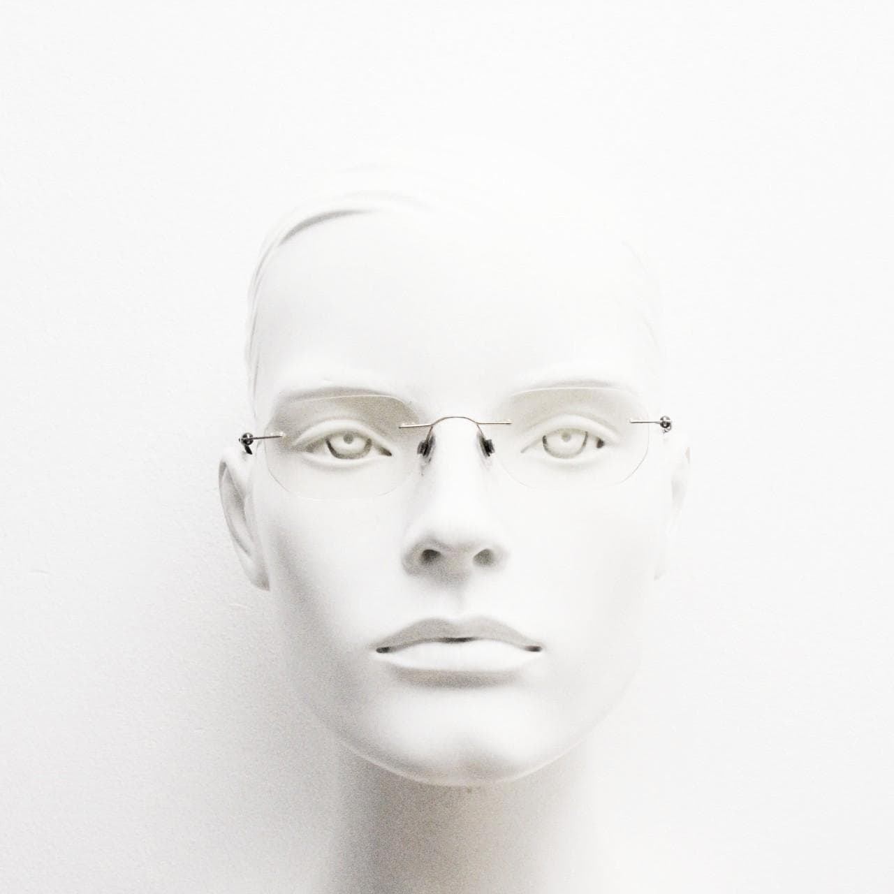 Silhouette vintage angular oval frameless eye glasses made in Austria. Minimal lightweight titanium optical frame. Prescription spectacles