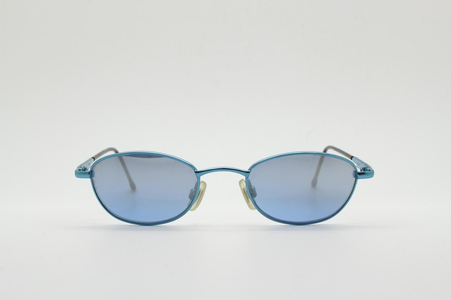 90s vintage small oval sunglasses by X-line. Unusual blue chrome metal frame with well matched mirror lenses. Quality NOS