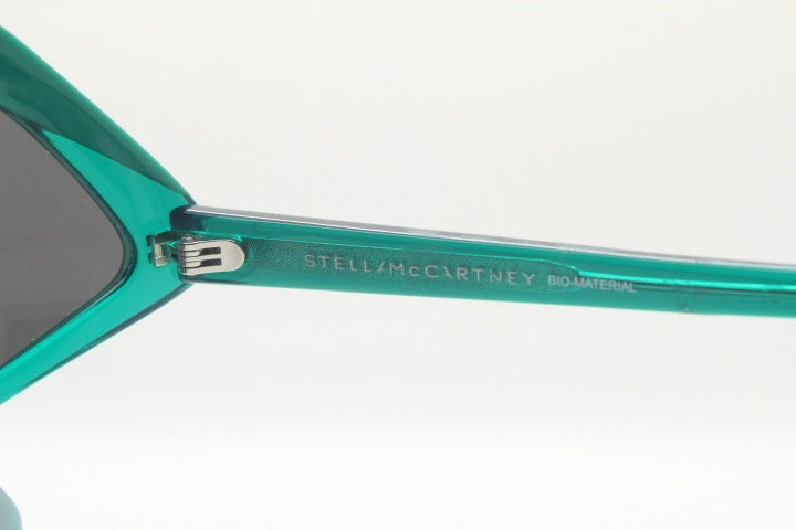 Stella Mc Cartney vintage abstract diamond sunglasses. Blockbuster fashion grail in transparent green acetate with dark lenses. NOS