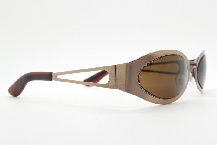 2000s vintage wraparound angular sunglasses. Brown chrome flat curved metal frame with cut out arms. 90s. Y2K unused NOS