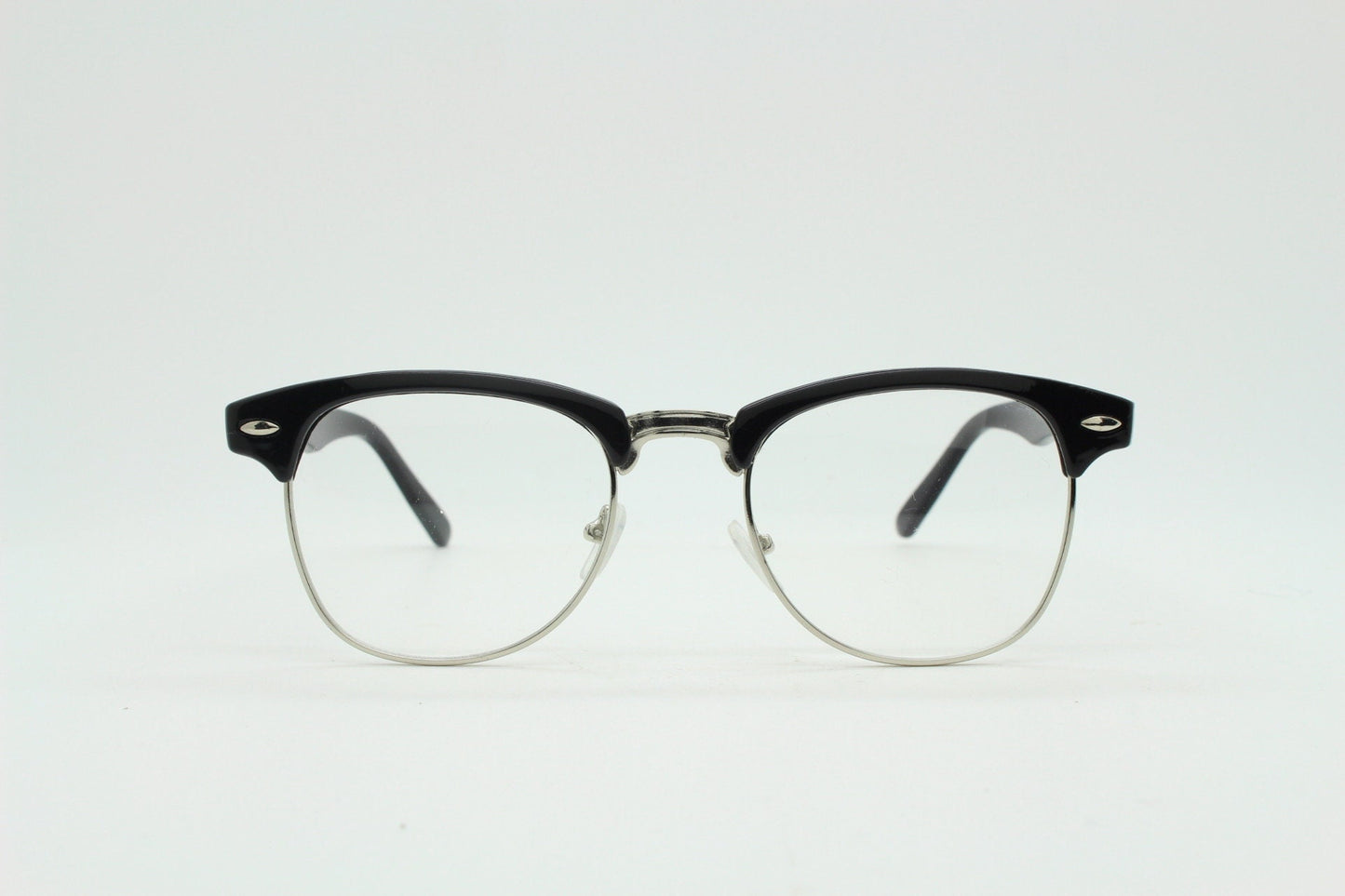 90s vintage black half frame eye glasses. Black gloss browline with silver wire rim frame and clear lenses. Classic 50s, 60s design. NOS