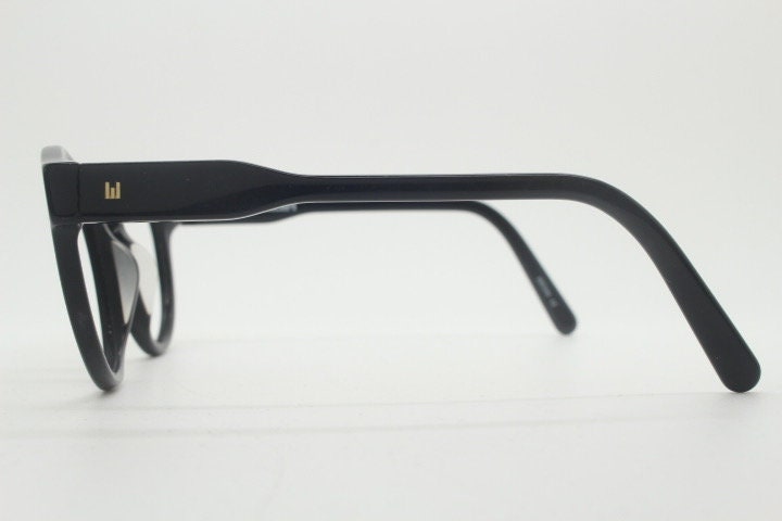 Will i Am round thick frame glasses model 30715554. Black gloss acetate optical frames with keyhole bridge. Prescription eyeglasses. RX
