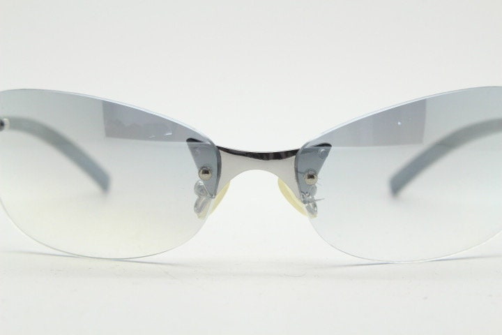 Y2K vintage wraparound sunglasses. Low profile frameless design in black matt finish with light tone graduated mirror lenses. 2000's. NOS