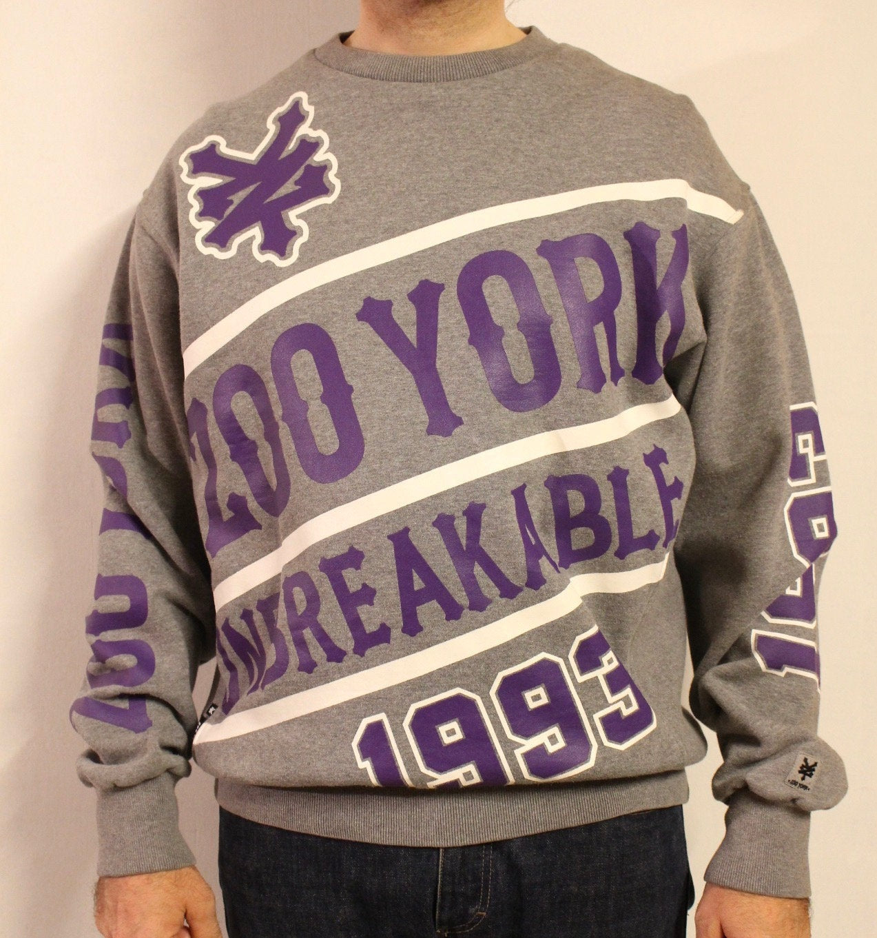 Zoo York vintage sweatshirt. Grey crew neck pullover with massive purple spell out graphic vinyl print. Round neck jumper. Mens medium