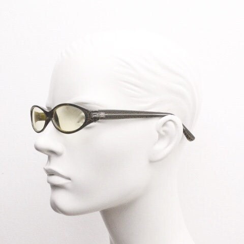 90s vintage abstract oval sunglasses. Thick curve around black frame with psychedelic yellow crackle print. Mini mask. Cosplay NOS