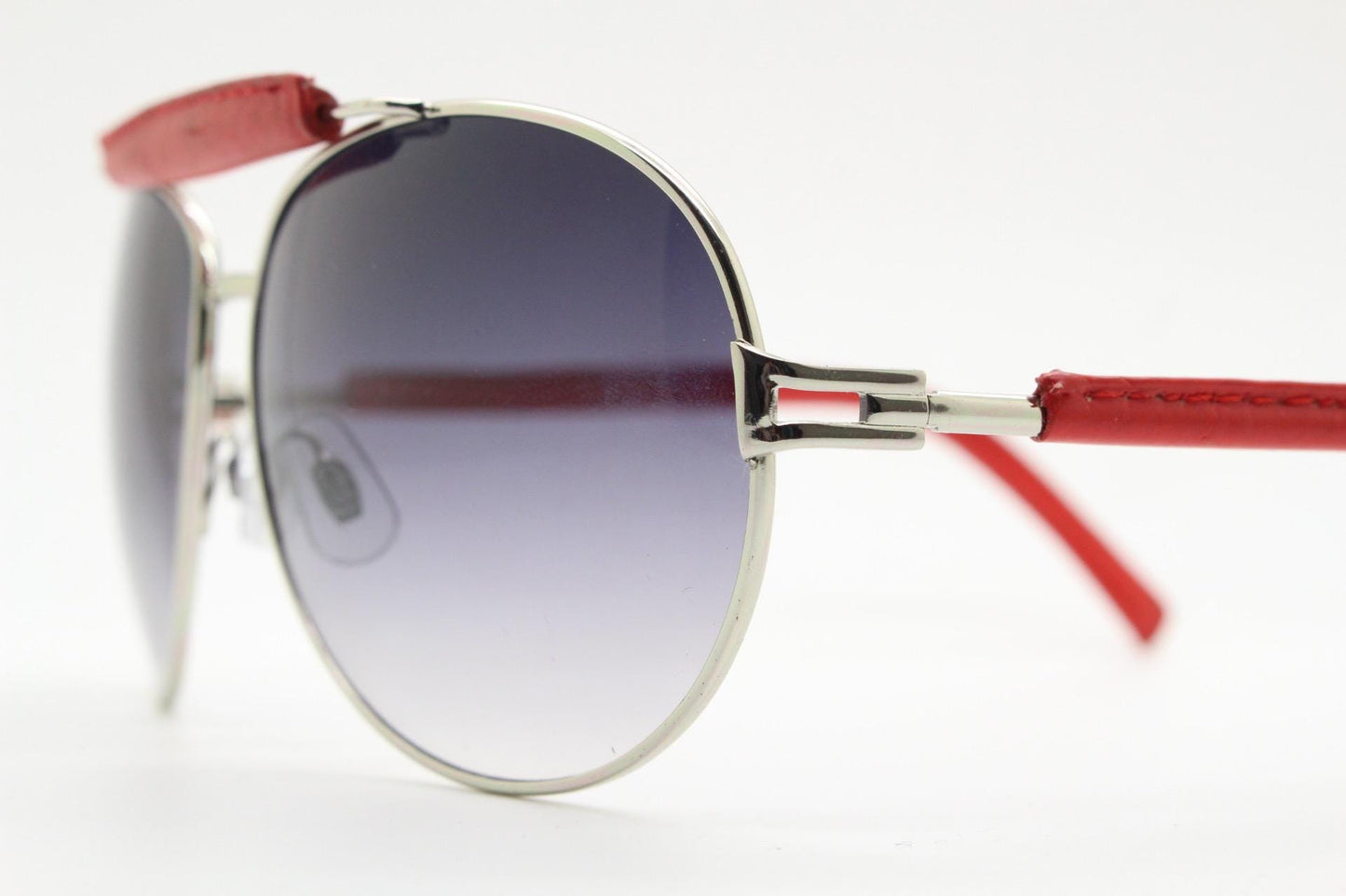 Y2K vintage aviator sunglasses. 2000's silver metal frame with exaggerated bridge in red trim. 70s racing design. 00's NOS aviators