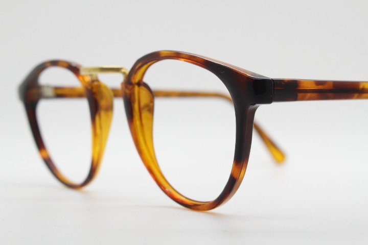 90s vintage round eye glasses. Minimal slim tortoise optical frames with gold bridge. 40s, 50s design prescription eyeglasses. RX spectacles