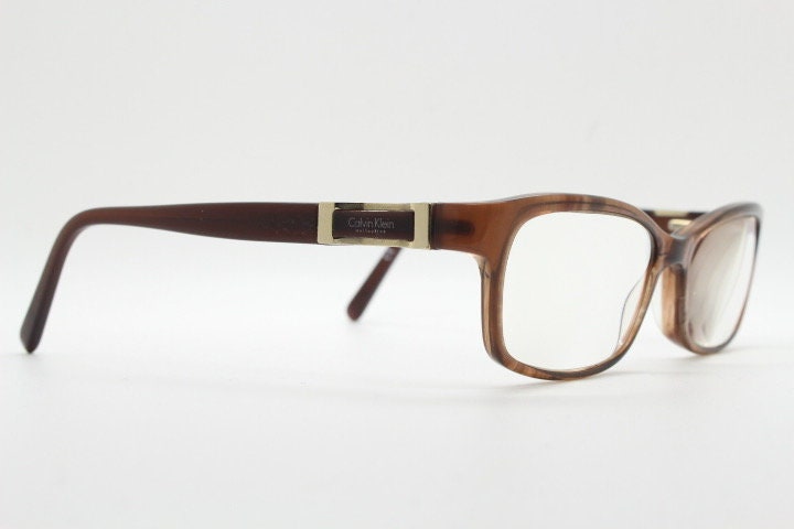 Calvin Klein collection rectangular cat eye glasses model 7851. Tortoise gloss acetate optical frames. Prescription eyeglasses. RX