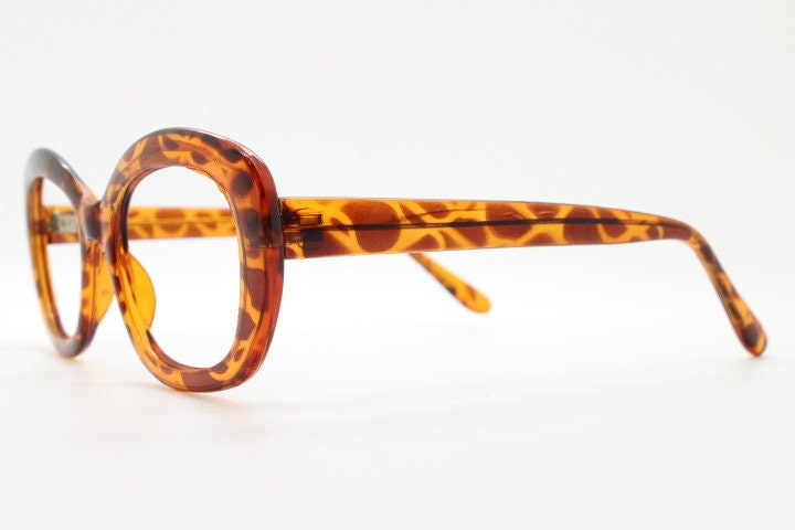 90s vintage angular rounded eye glasses. Transparent vibrant amber giraffe pattern optical frame. Womens prescription eyeglasses. RX