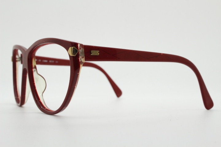 Silhouette 80s vintage oversized cat eye glasses made in Austria. Dramatic red prescription optical frame with subtle criss cross stripes RX