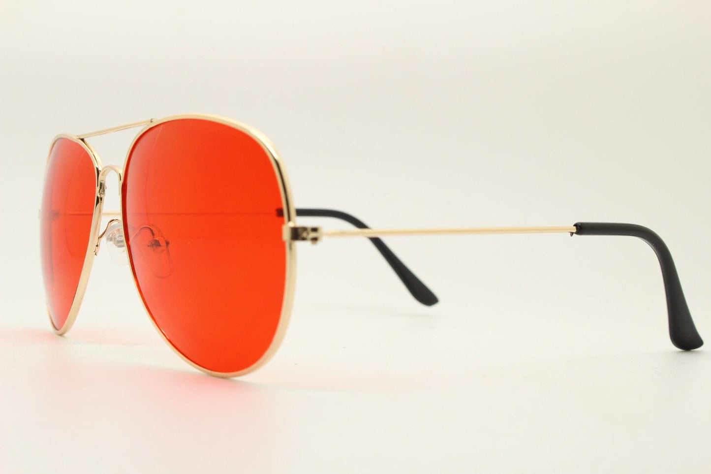 Y2K vintage teardrop aviator sunglasses. Gold chrome metal frame 70s design aviators with intense red lenses. 2000s. Unused NOS